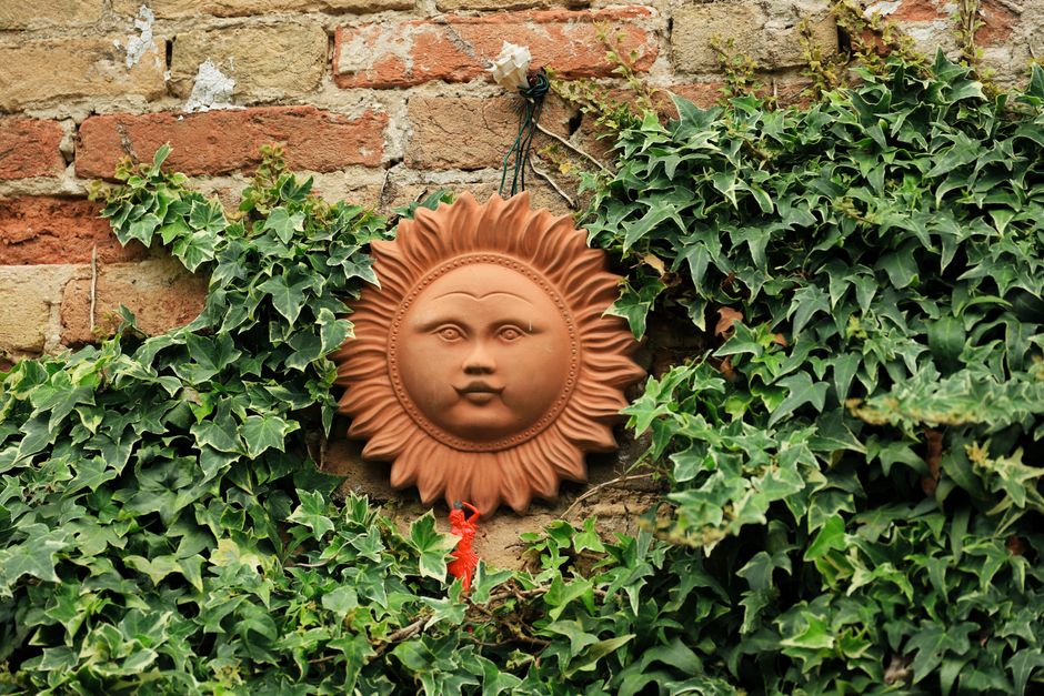 Terracotta planters complementing a lush garden view.