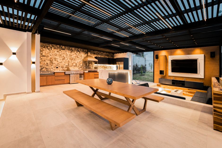 Outdoor kitchen with cozy seating area. Outdoor kitchen with cozy seating area.