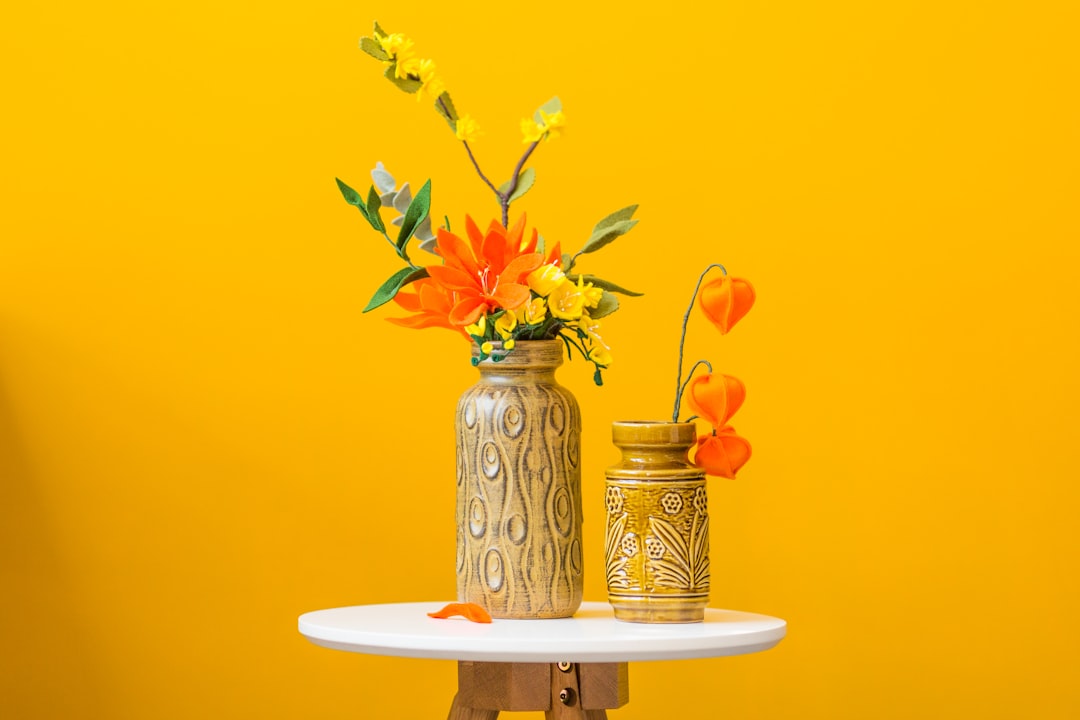 Terracotta candles on a rustic wooden table. Terracotta candles on a rustic wooden table.